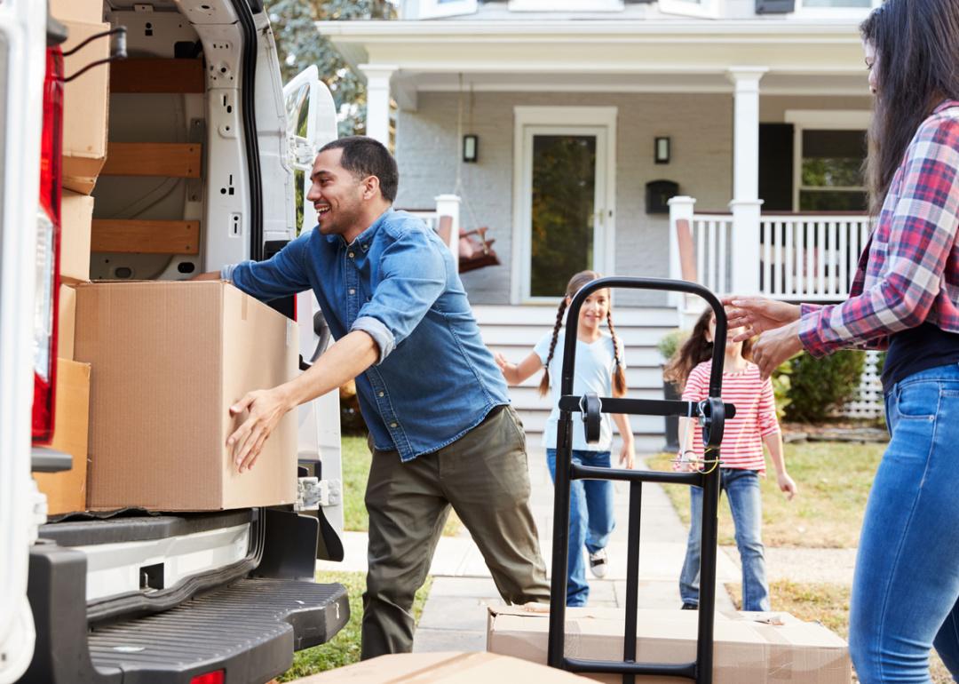 Family loading up moving truck