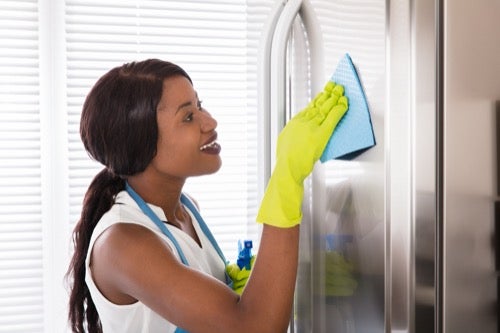 young-woman-cleaning-wearing-rubber-gloves.jpg